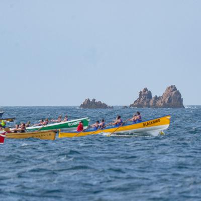 Ladies A heading out in front while rowing in the Scillies 